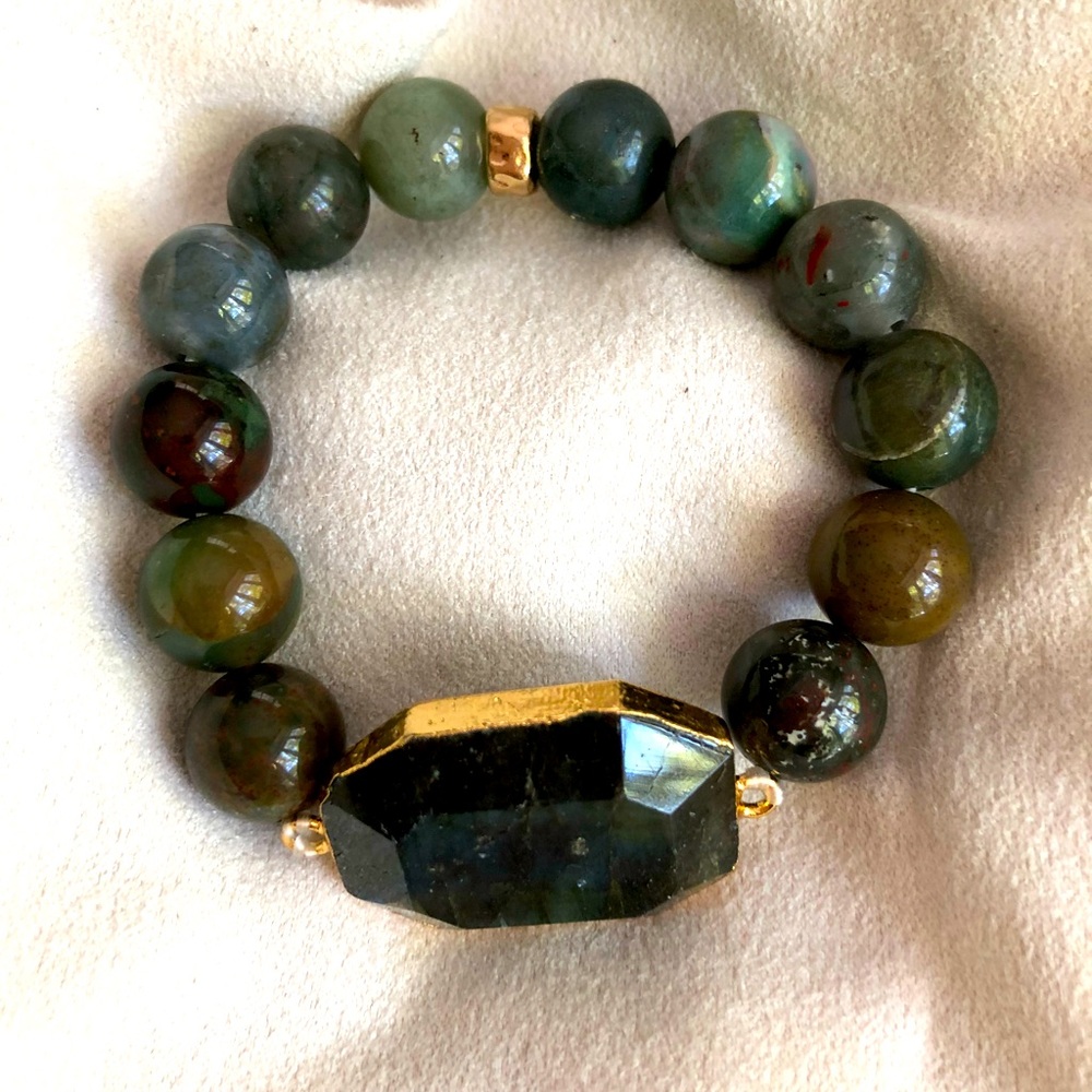 Handmade gemstone stretch bracelet. Lapis stone focal charm with gold accent.